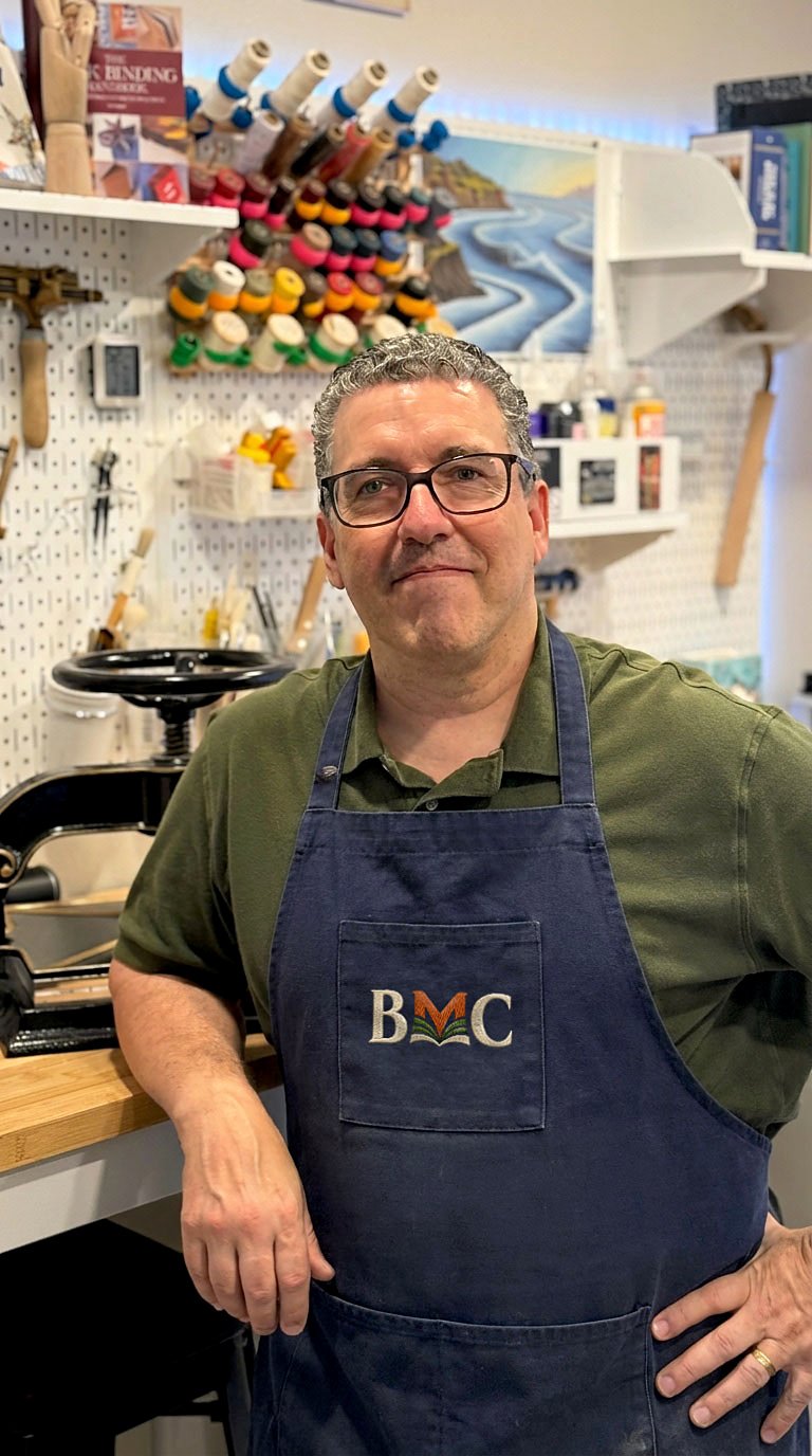 Bob Bender, founder of Book Makers Craft, at his bookbinding bench
