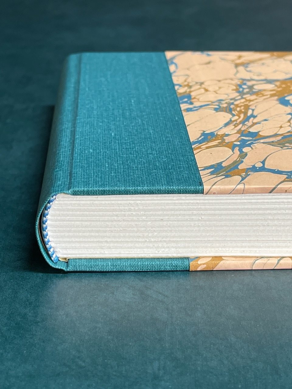 Book cloth and marbled paper combined on a quarter binding